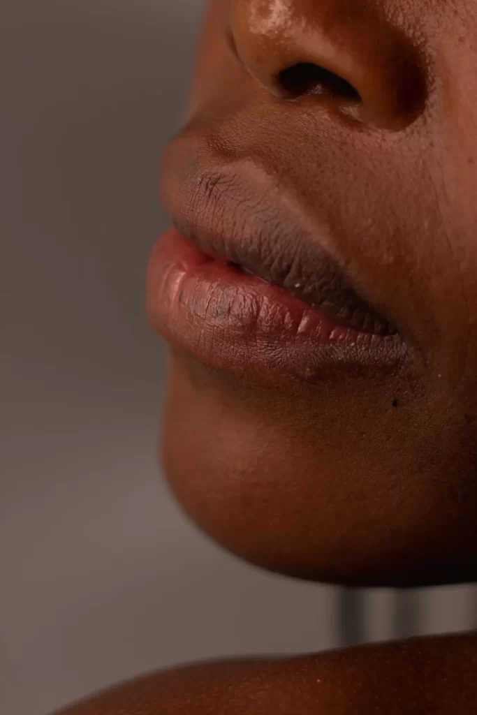Close-up of textured lips and skin highlighting natural complexion and barrier health