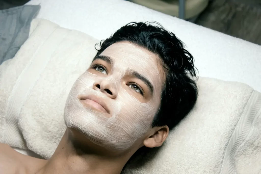 Man with facial mask during a skincare treatment at a spa